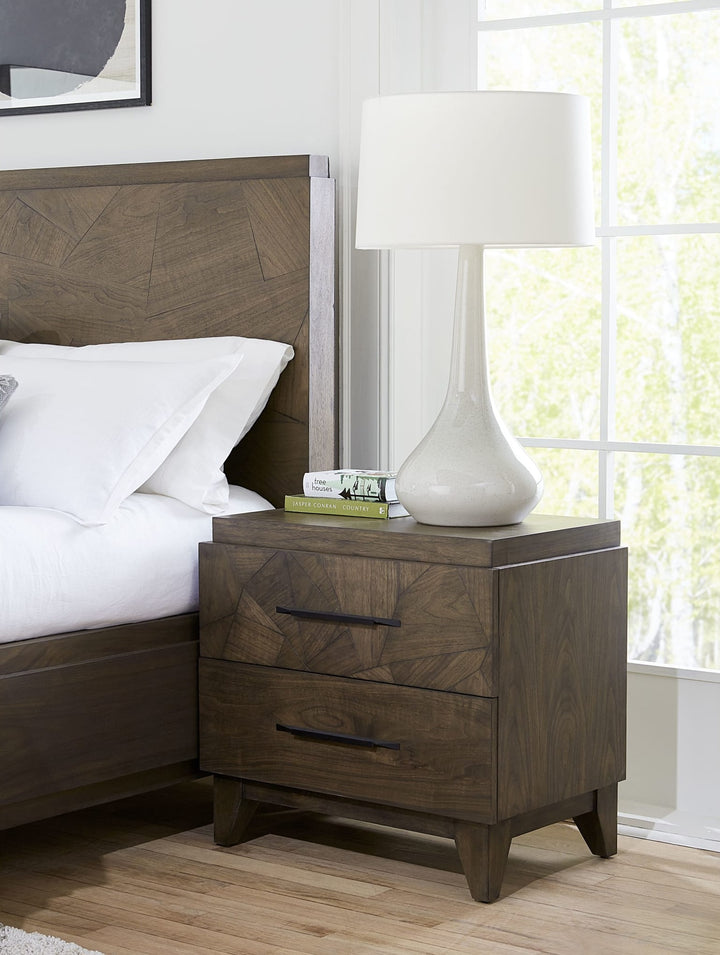 Broderick Two Drawer Nightstand in Wild Oats Brown — in a bedroom setting