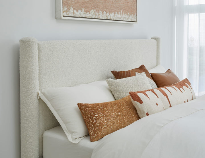 Burke Upholstered Platform Bed in Cottage Cheese Boucle styled in a bedroom
