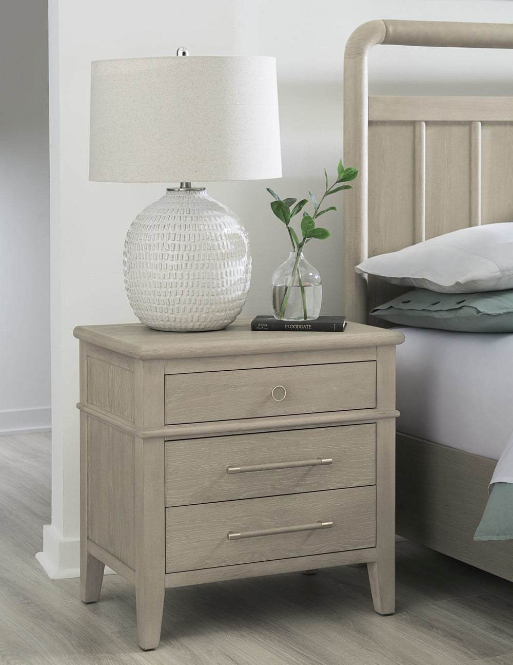 Camden Three Drawer Nightstand in Chai — in a bedroom setting