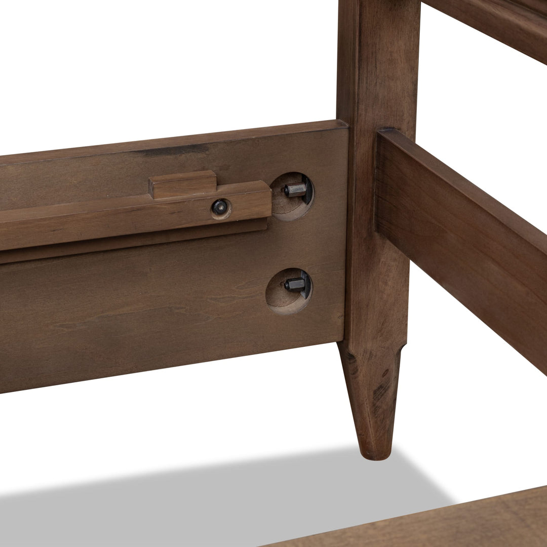 Carlisle Wood Panel Bed — close-up of the footboard post and rail fitting
