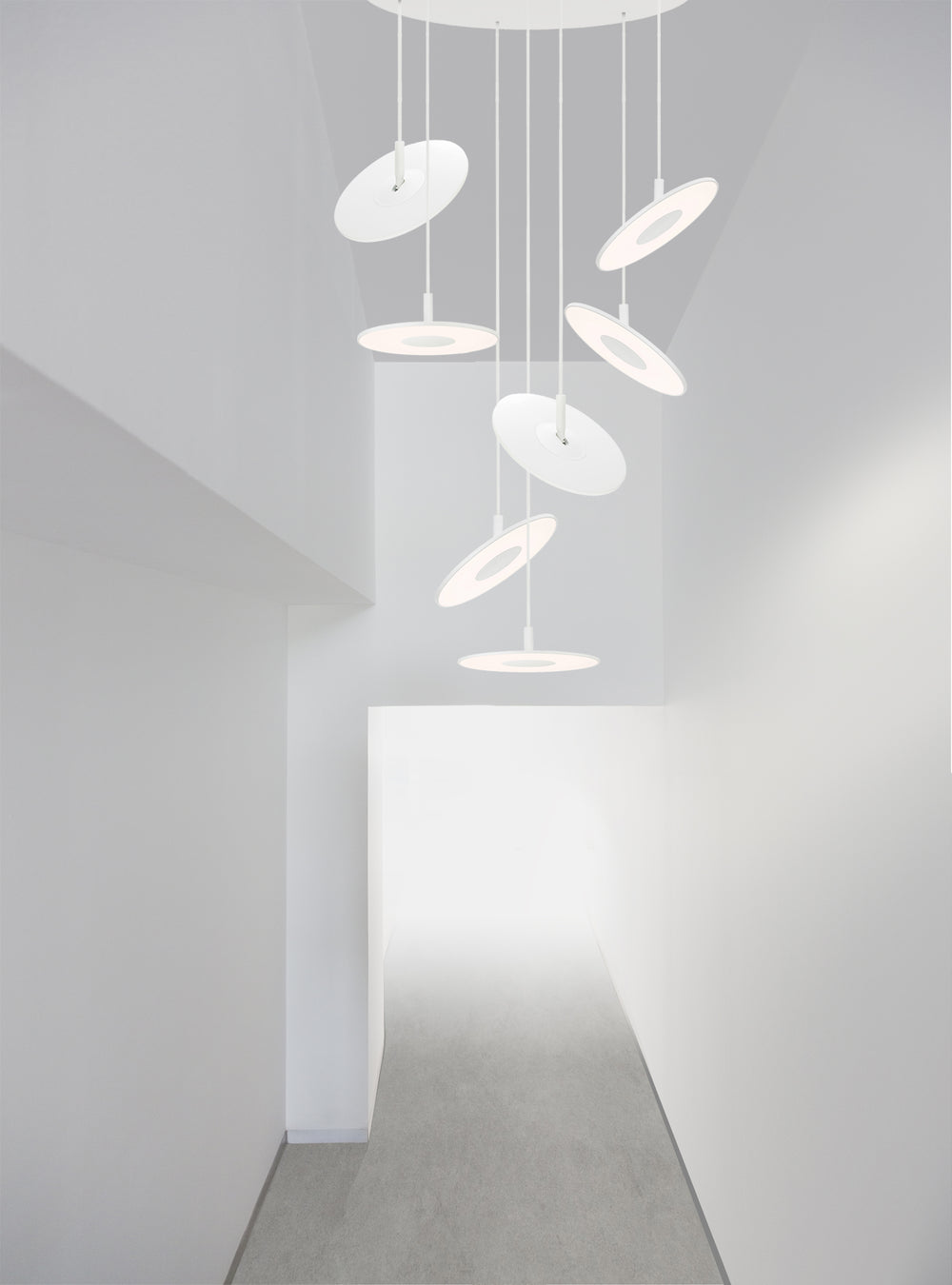 Circa Chandelier 5 by Pablo Designs in a bright modern hallway