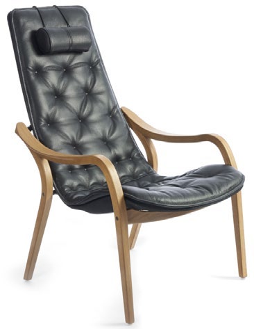 Conform Bravo Fixed chair in dark tufted upholstery with a padded headrest, curved wood arms and four wood legs