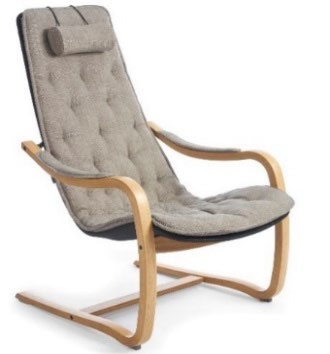 Conform Bravo Flex chair in light gray tufted fabric with a padded headrest and curved wood cantilever frame