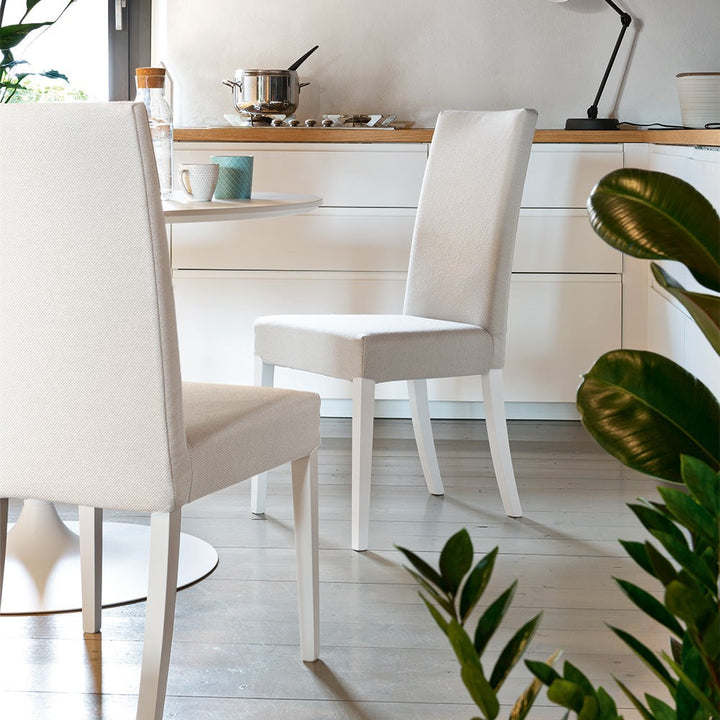 Copenhagen Wood Upholstered Dining Chair by Connubia in a styled interior
