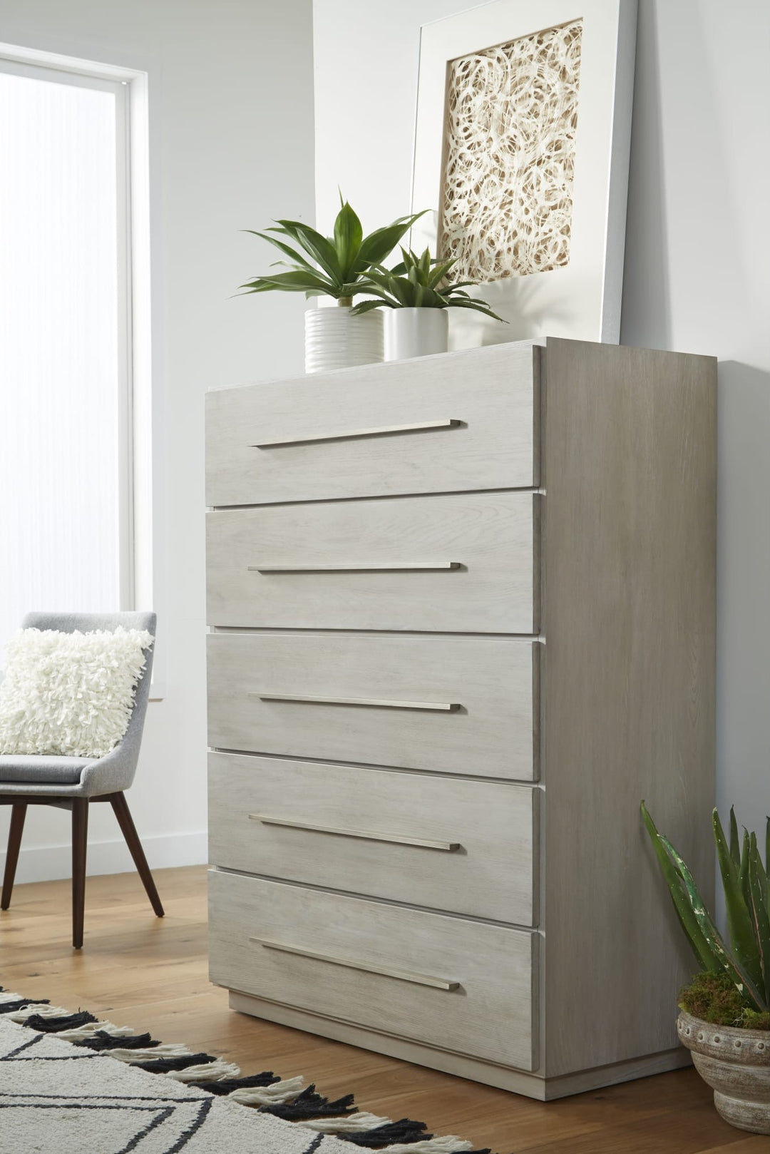 Destination Five Drawer Chest in Cotton Grey — styled in a room