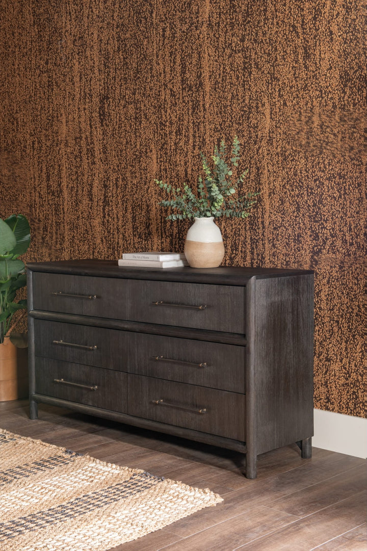 Dorsey Six Drawer Dresser in Basalt Grey styled against a textured wall