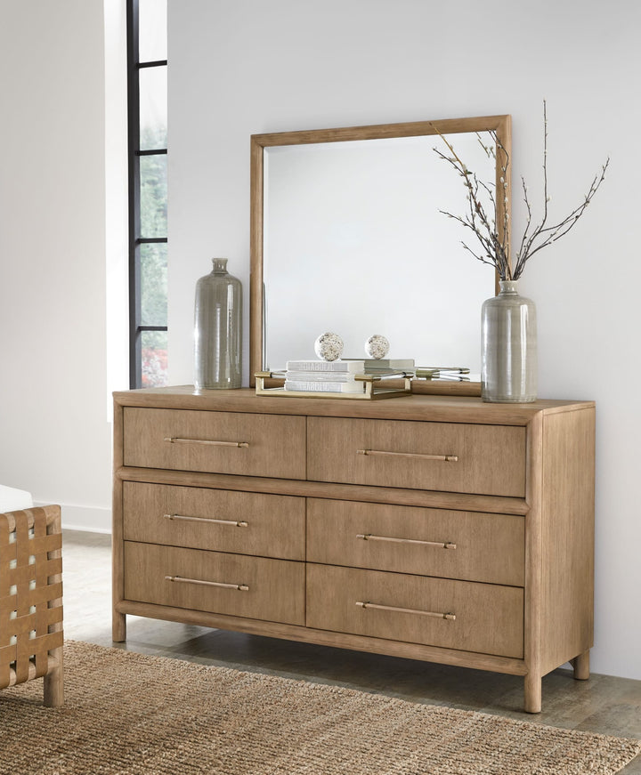 Dorsey Solid Wood and Glass Mirror in Granola on the Dorsey dresser (sold separately) in a bright bedroom