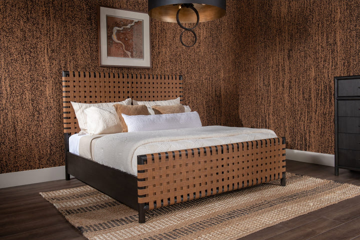 Dorsey Woven Panel Bed in Basalt Grey and Ginger styled in a warm-toned bedroom