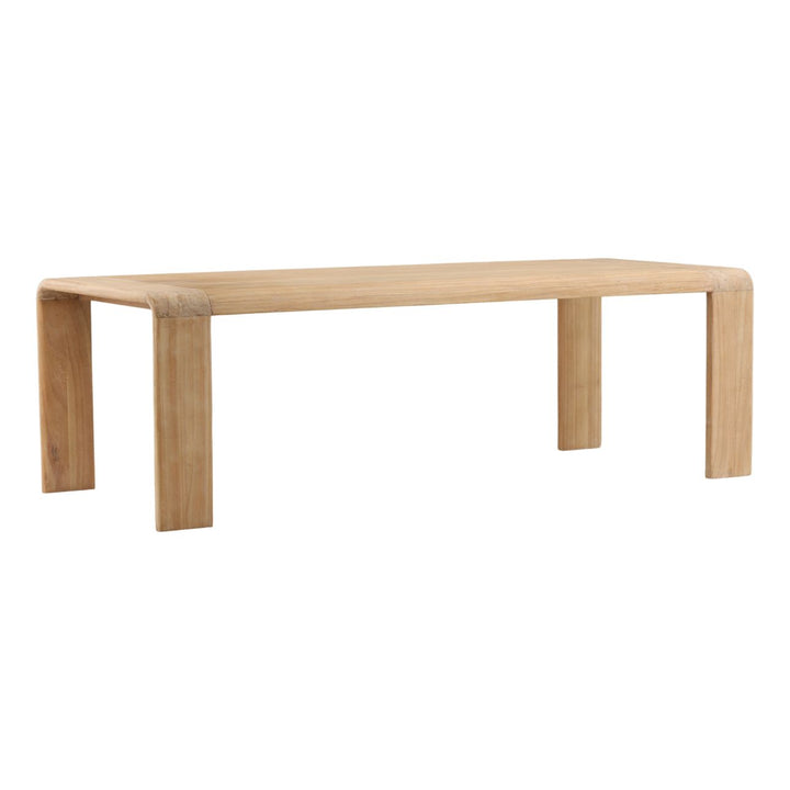 Cora Natural Mindi Wood Dining Table, three-quarter studio view
