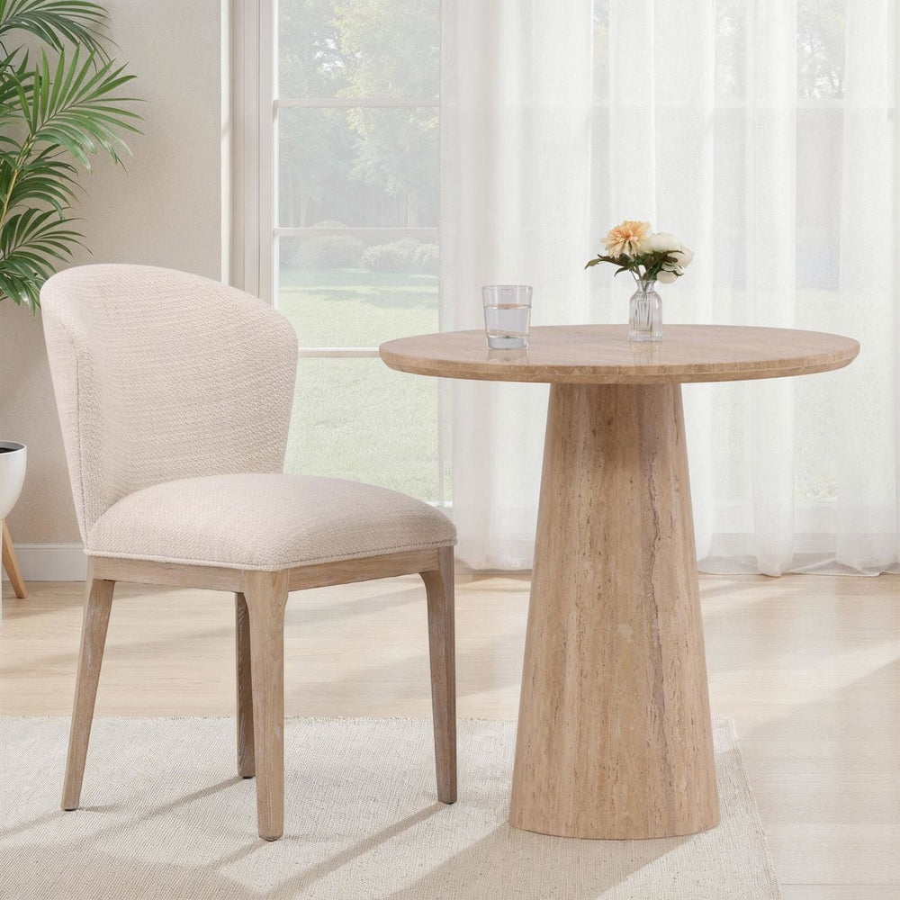 Priselle Natural Travertine Bistro Table, lifestyle view