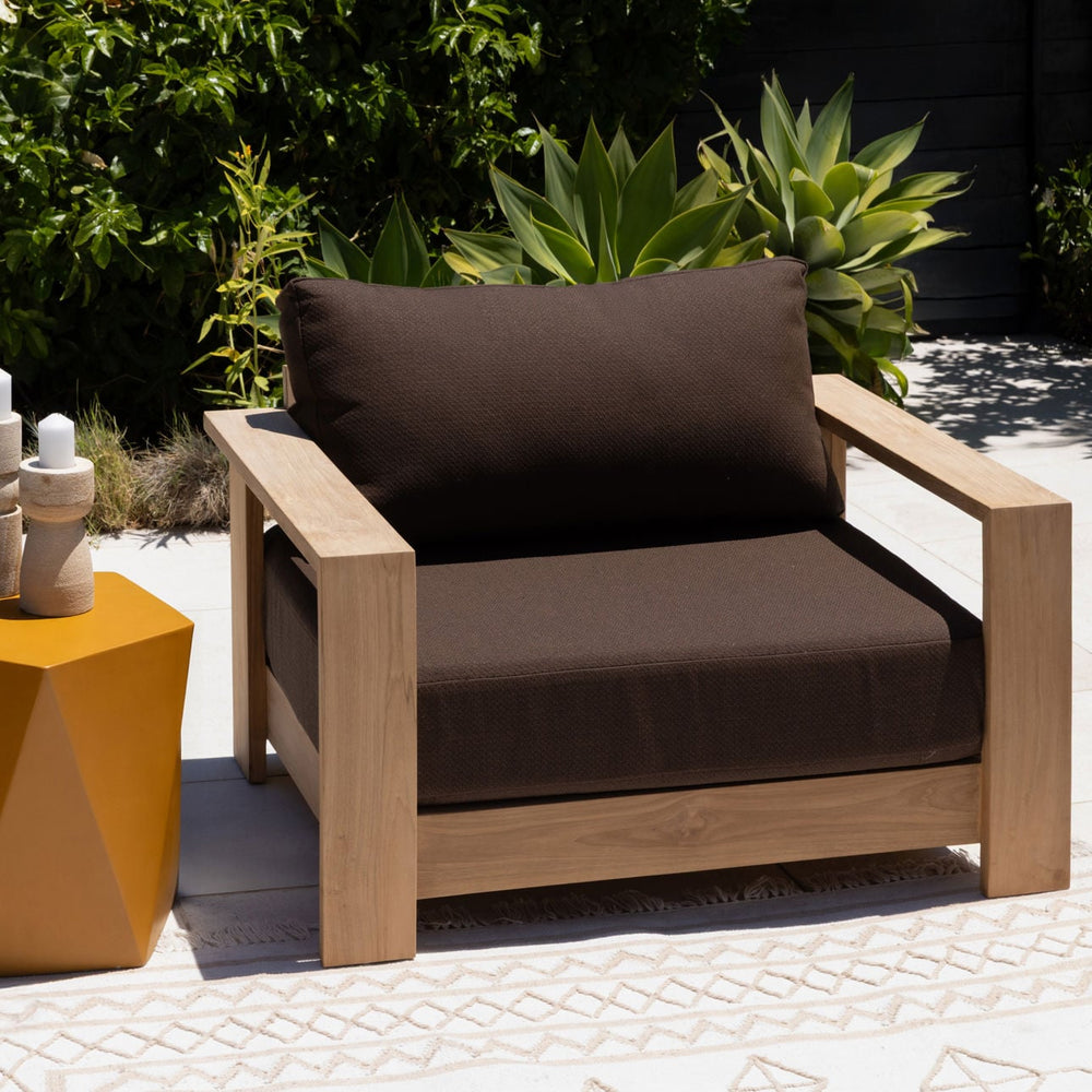 Nayren Chocolate Teak Outdoor Lounge Chair, lifestyle view