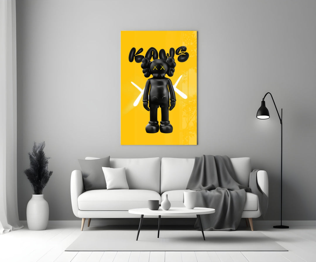 Kaws glass wall art styled above a sideboard in a powder room