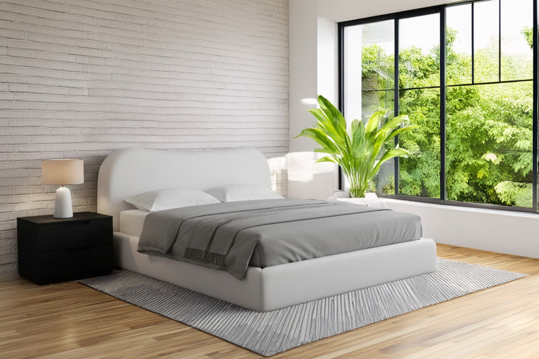 Elena Upholstered Bed in Vanilla Linen styled in a bedroom