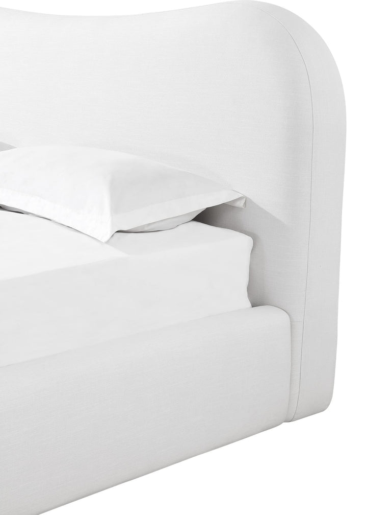 Elena Upholstered Bed in Vanilla Linen — close-up of the curved headboard