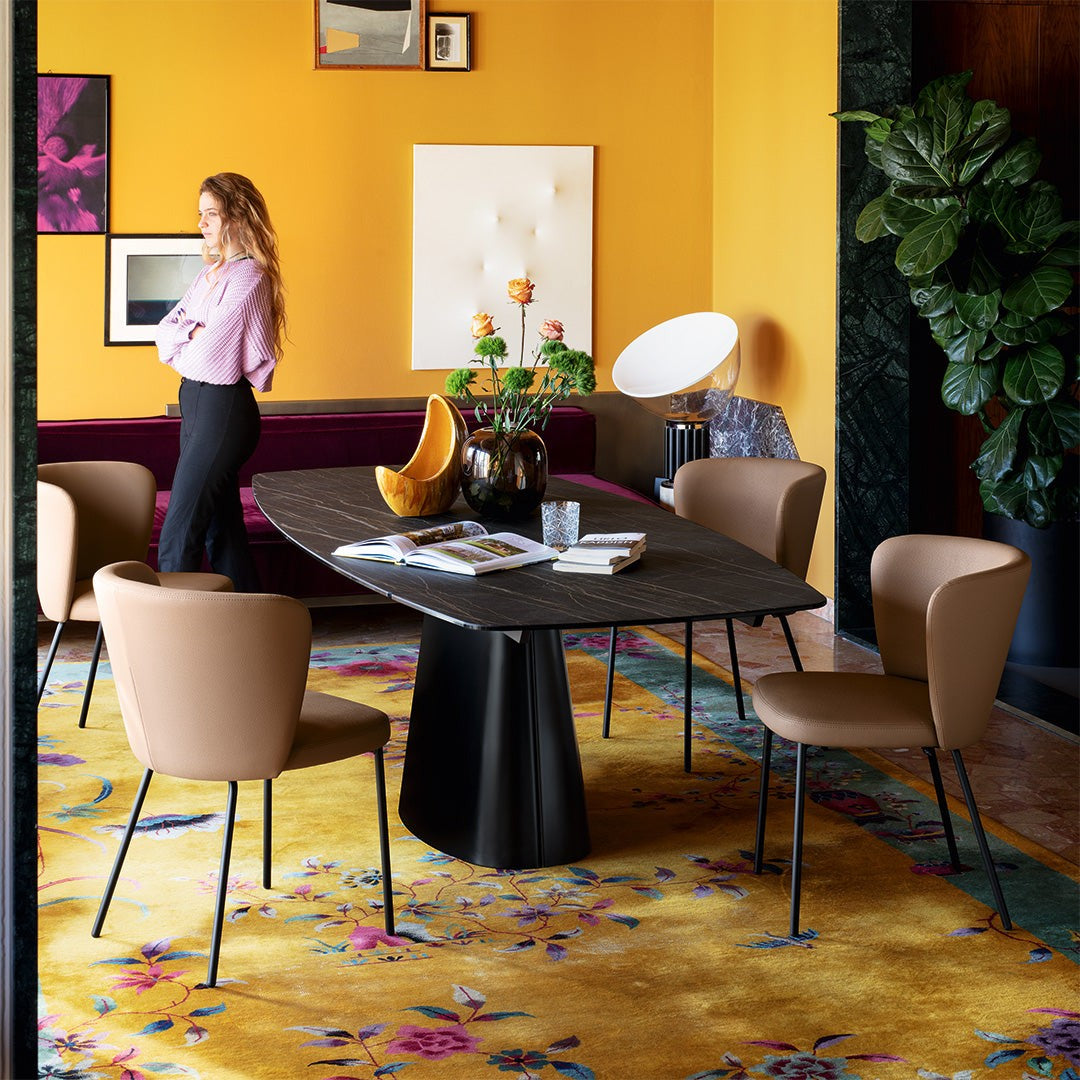 Ellisse Barrel Extendable Dining Table by Connubia in a styled interior