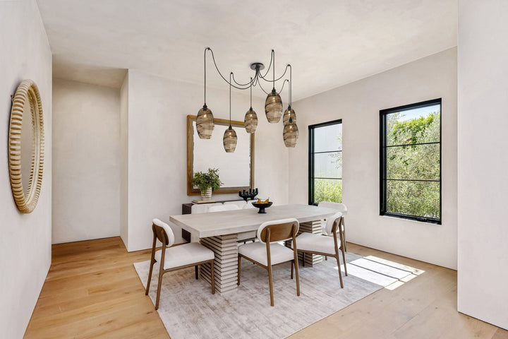 Ellisse Swag Chandelier by Hammerton Studio in a styled interior