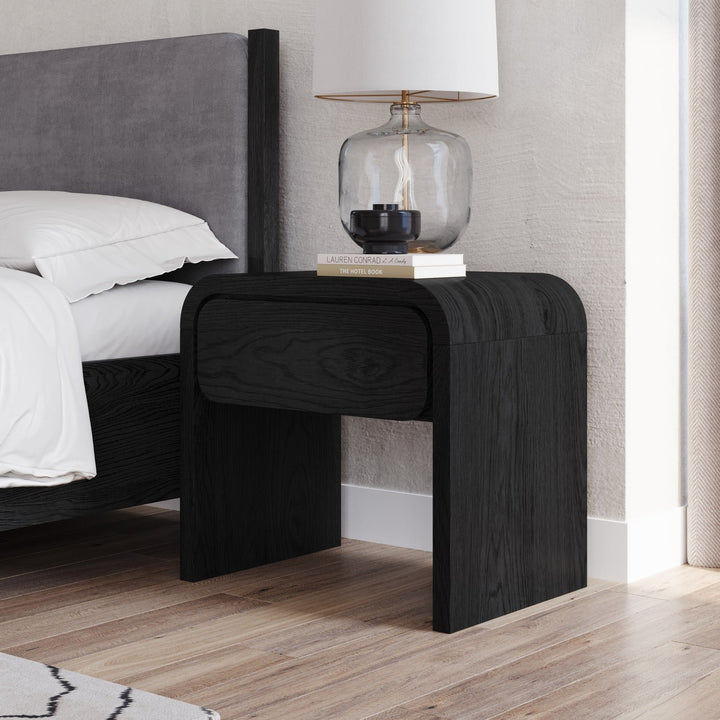 Elora One Drawer Nightstand in Jet — in a bedroom setting