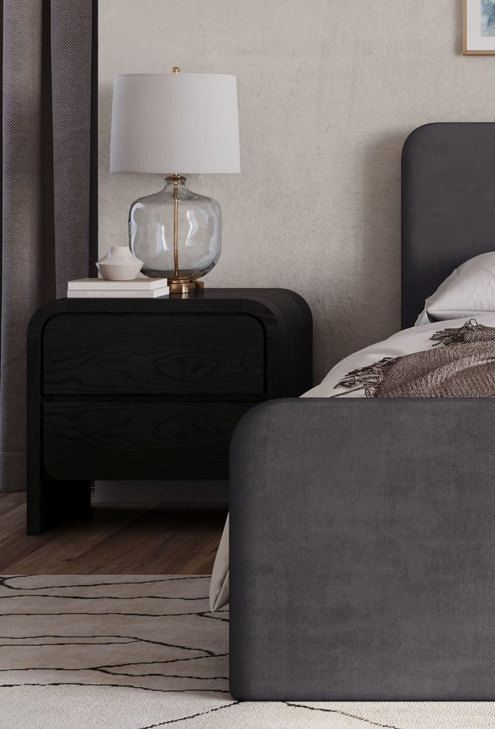 Elora Two Drawer Nightstand in Jet — in a bedroom setting