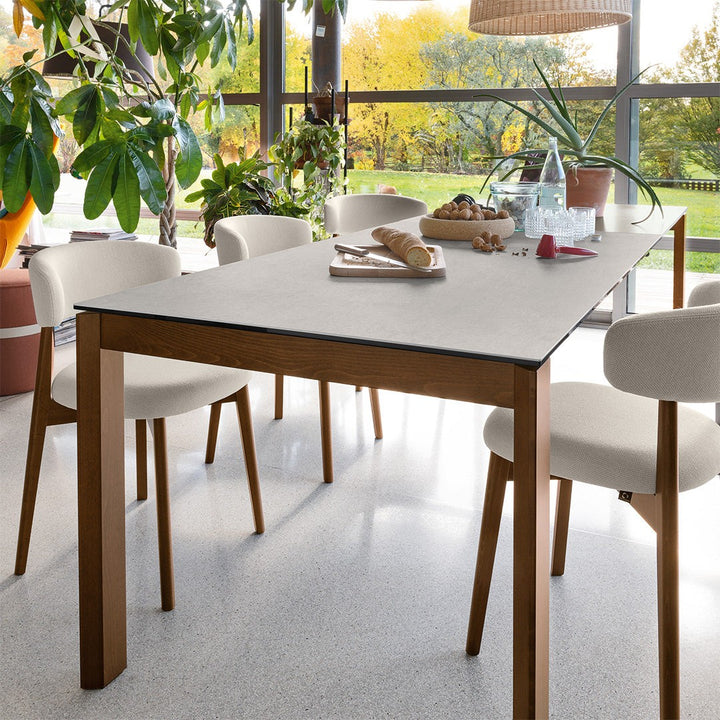 Eminence Wood Extendable Dining Table by Connubia in a styled interior