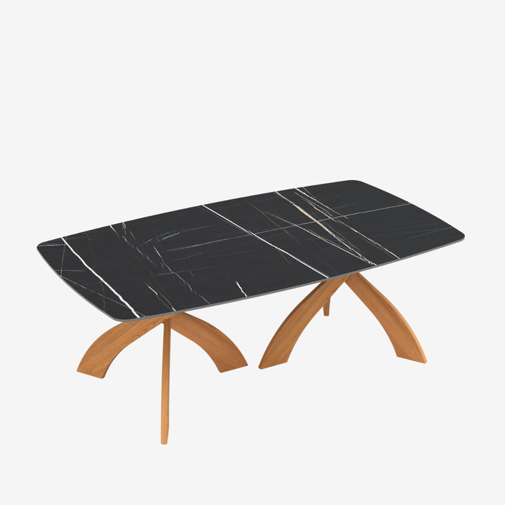 Entwine boat shaped Sahara Noir stone dining table