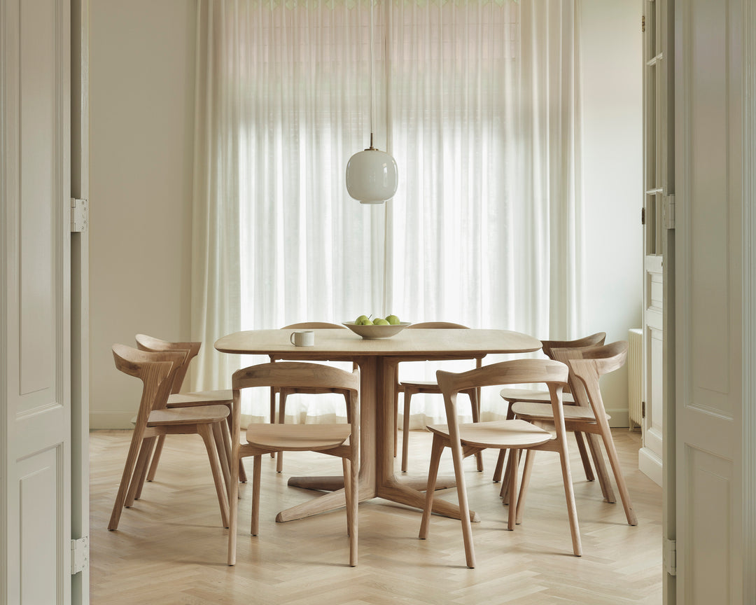 Ethnicraft Corto dining table styled in a modern dining interior