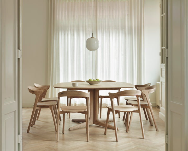 Ethnicraft Corto dining table styled in a modern dining interior