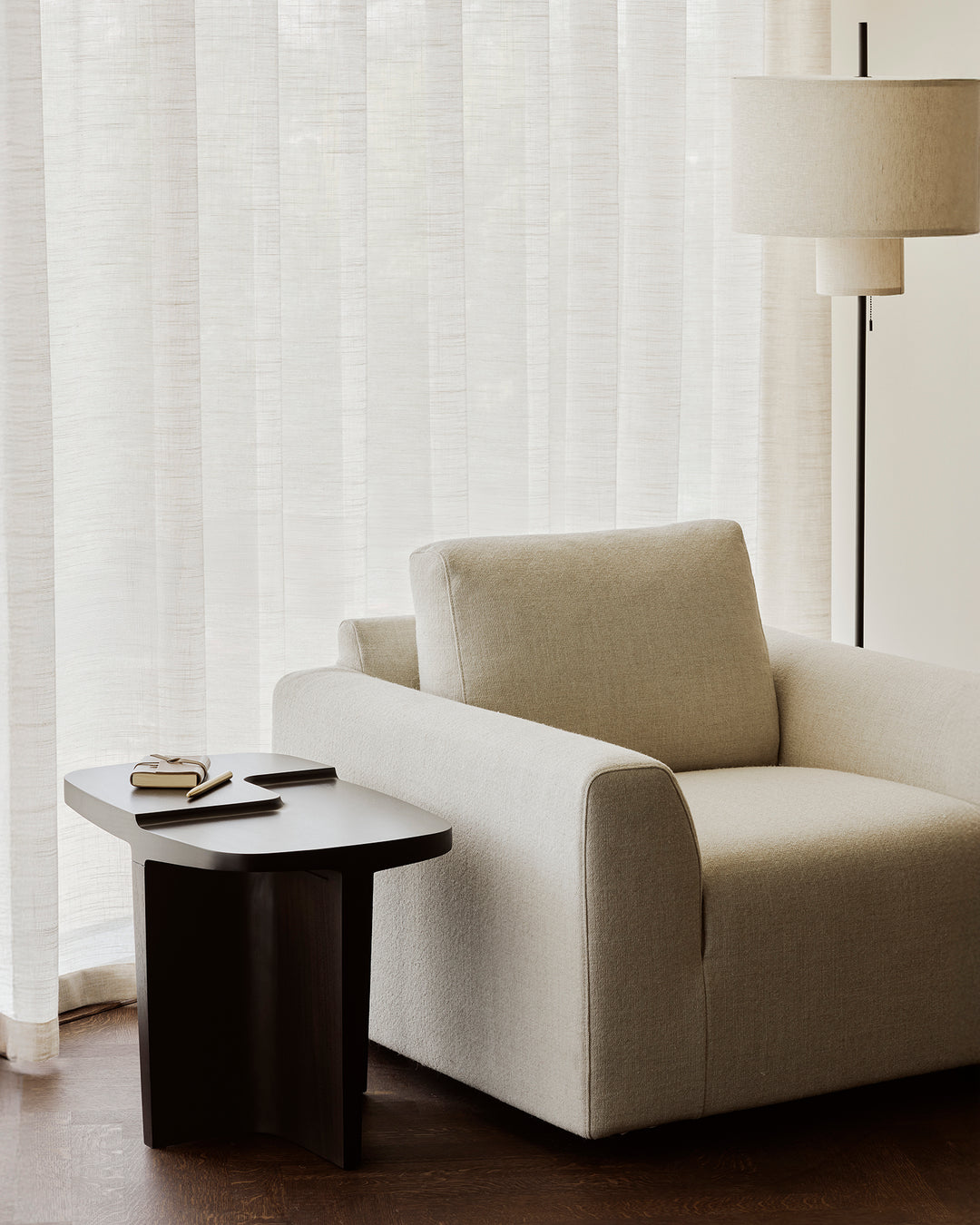 Ethnicraft Ease lounge chair styled in a modern living room