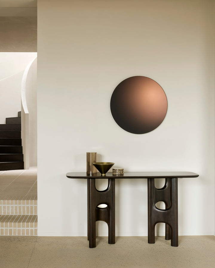 Ethnicraft Flow rose brown console in a styled interior