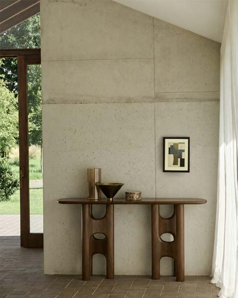 Ethnicraft Flow teak console in a warm modern interior