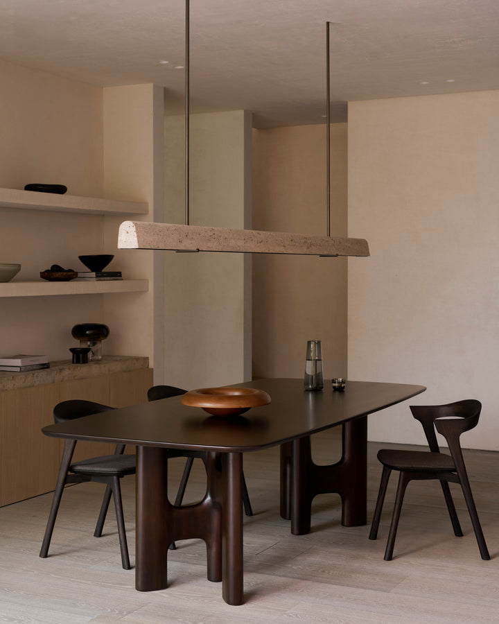 Ethnicraft Flow rose brown dining table in a styled dining room