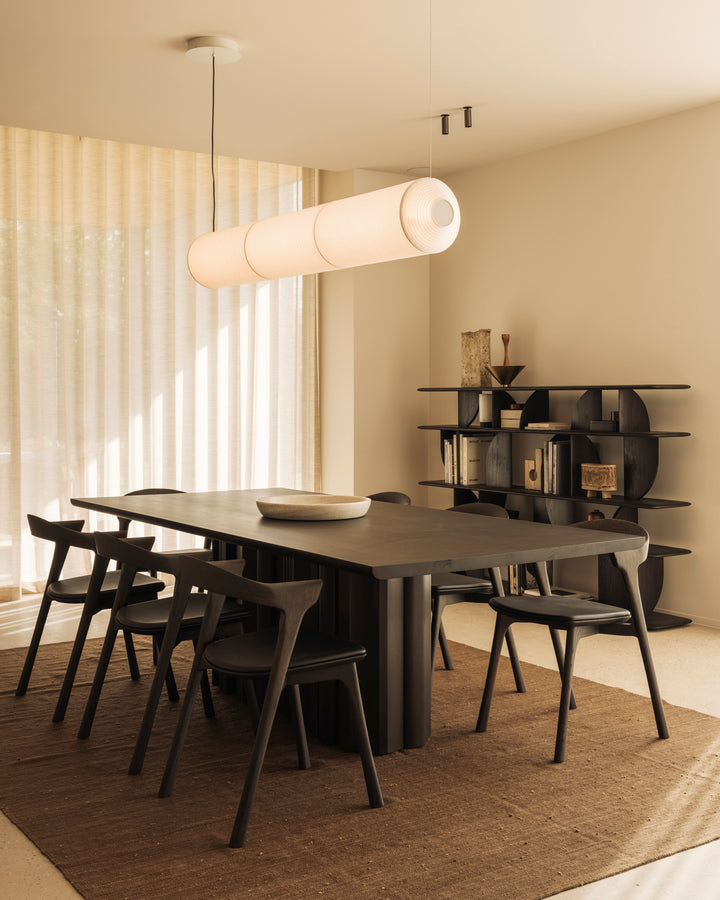 Ethnicraft Sequence mahogany dining table in a modern interior