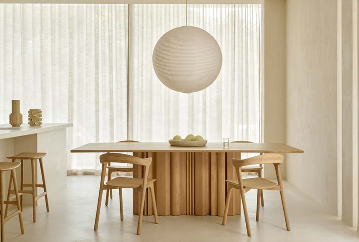 Ethnicraft Sequence dining table in a bright modern dining room