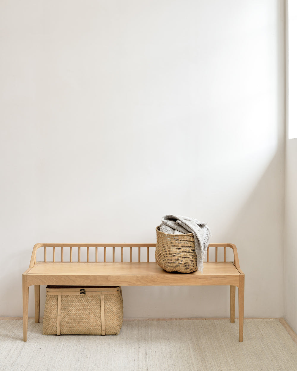 Ethnicraft Spindle bench styled in a modern interior