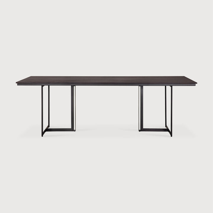 Ethnicraft Tacet dining table in dark brown teak on white background