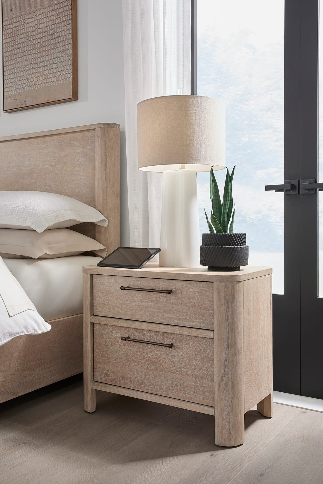 Evelyn Two Drawer Nightstand with Cord Management in Saltwood — in a bedroom setting