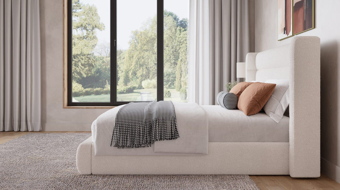 Frank Upholstered Wingback Platform Bed in Cottage Cheese styled in a bedroom