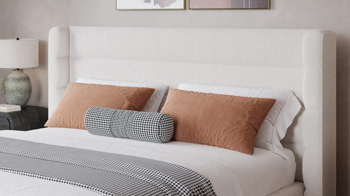 Frank Upholstered Wingback Platform Bed in Cottage Cheese styled in a bedroom