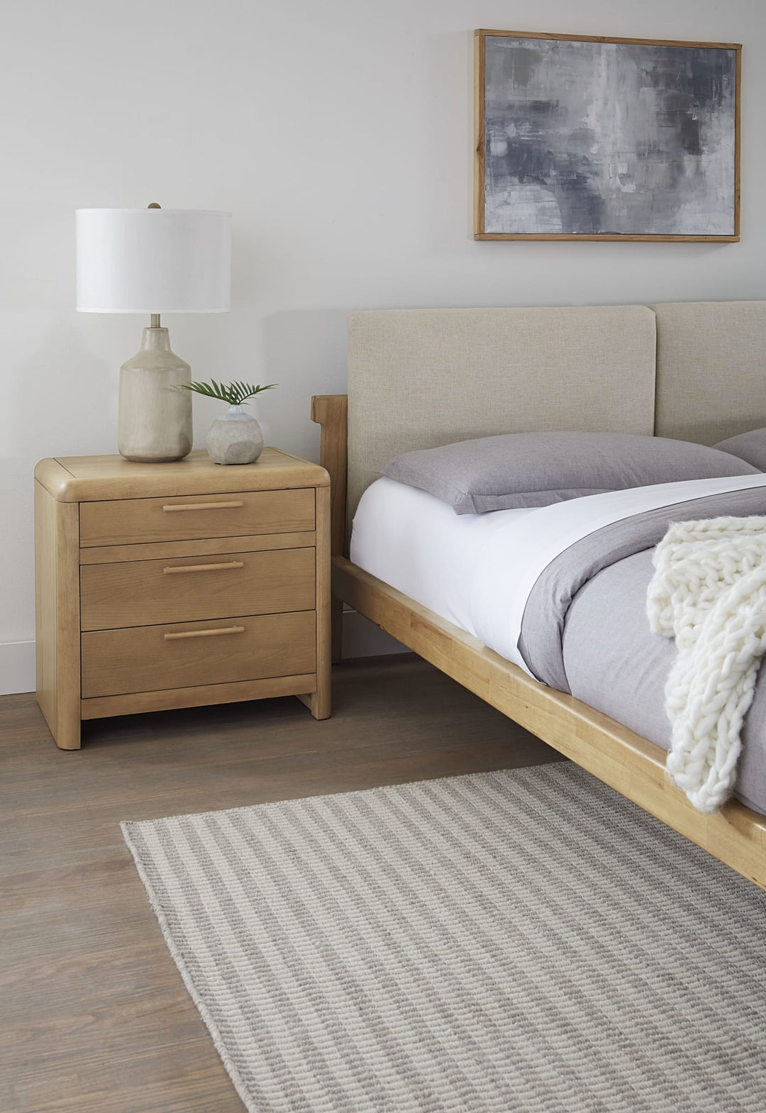 Furano Three Drawer Nightstand in Ginger beside a Furano bed