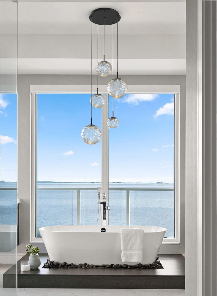 Gaia Round Pendant Chandelier by Hammerton Studio in a styled interior