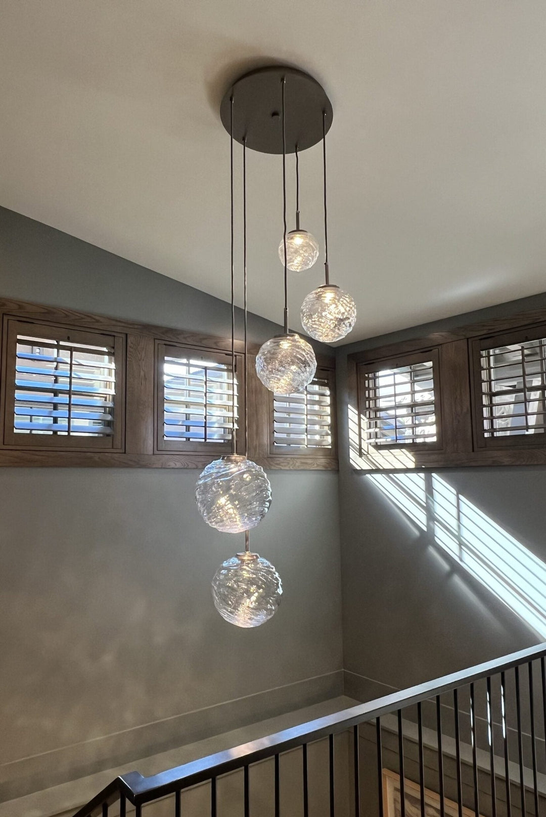Gaia Round Pendant Chandelier by Hammerton Studio in a styled interior