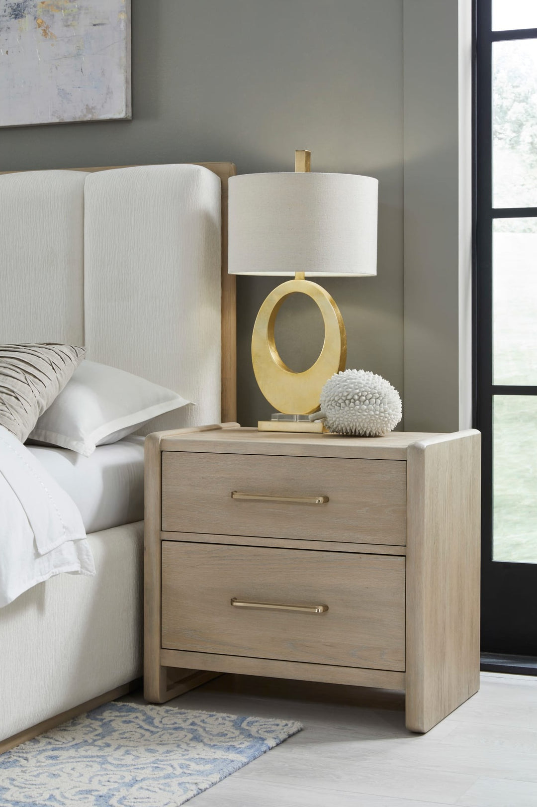 Gardenia Two Drawer Nightstand in Chai — in a bedroom setting