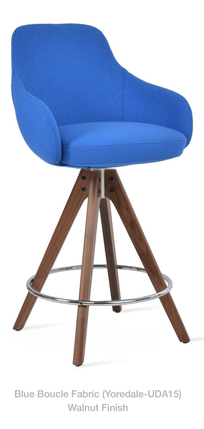 Gazel Arm Pyramid Wood Swivel Stool by Soho Concept — blue Camira bouclé fabric on walnut-finish legs with chrome footrest, front three-quarter view