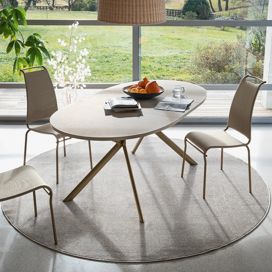 Giove Oval Extendable Dining Table by Connubia in a styled interior