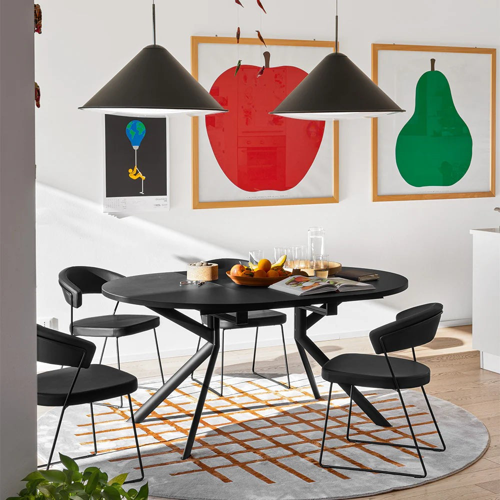 Giove Oval Extendable Dining Table by Connubia in a styled interior