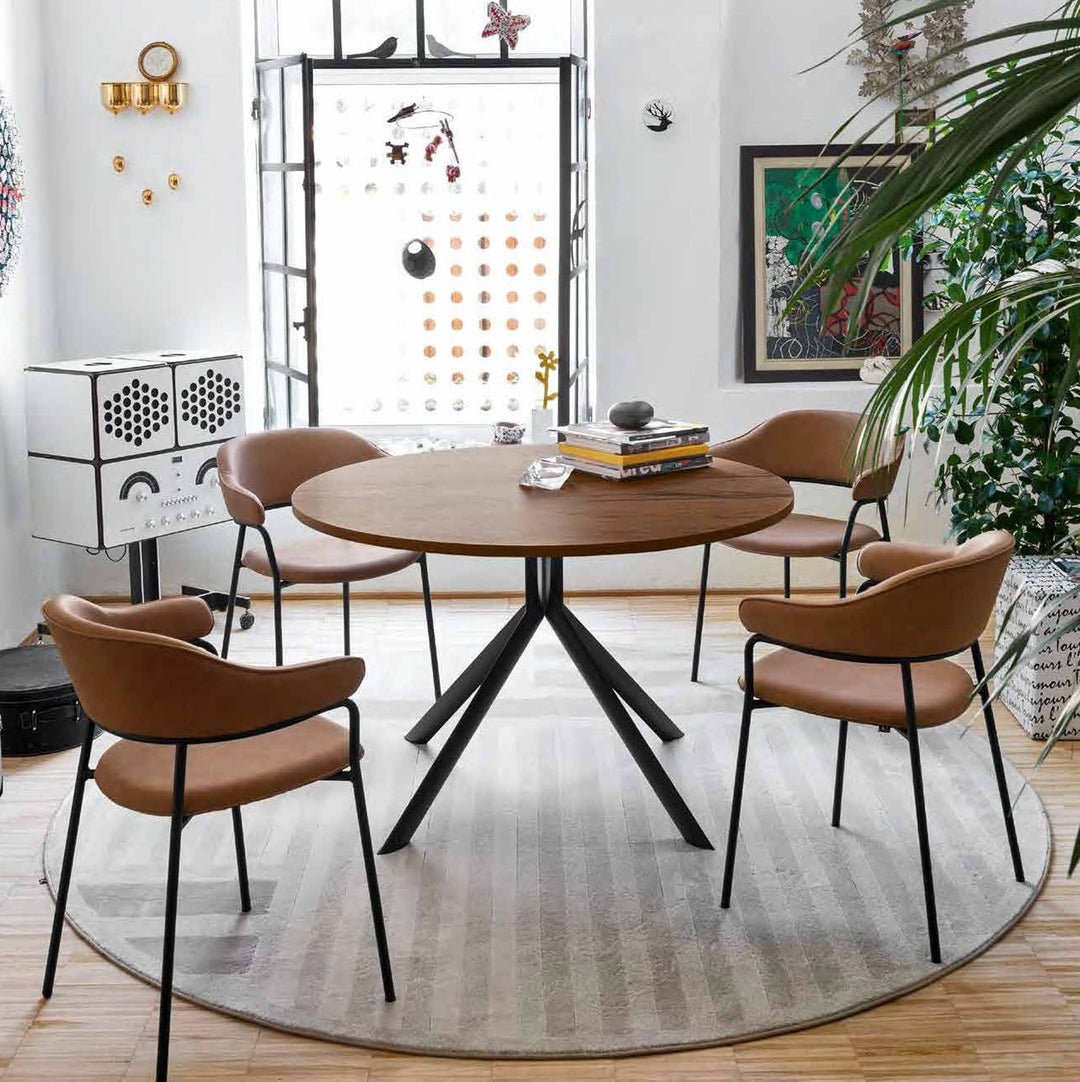 Giove Oval Extendable Dining Table by Connubia in a styled interior