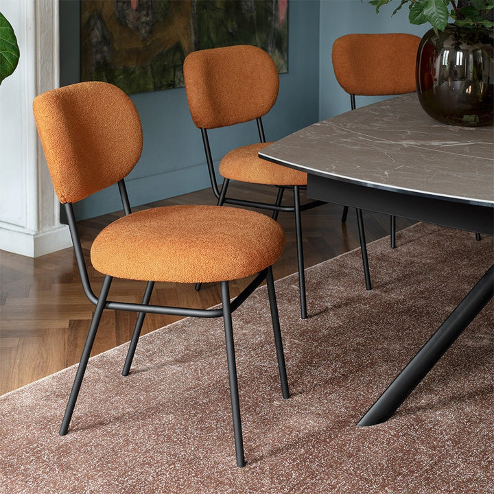Giove Plus Oval Extendable Dining Table by Connubia in a styled interior