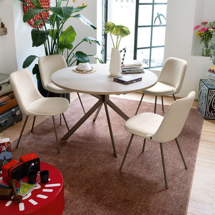 Giove Round Extendable Dining Table by Connubia in a styled interior
