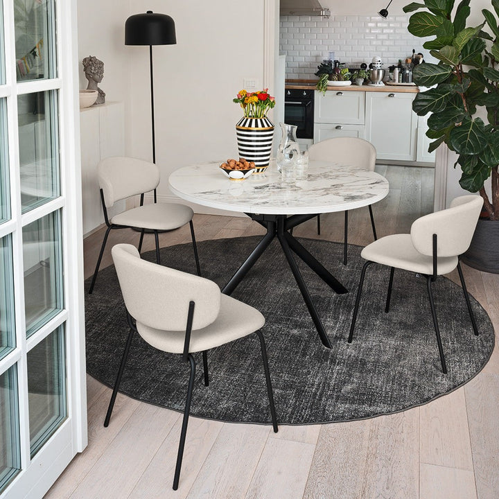 Giove Round Extendable Dining Table by Connubia in a styled interior