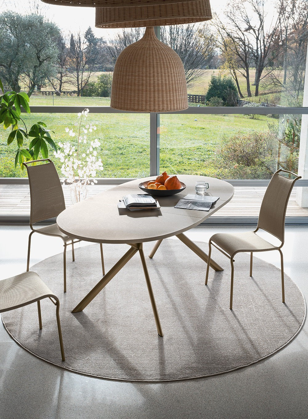 Giove Round Extendable Dining Table by Connubia in a styled interior