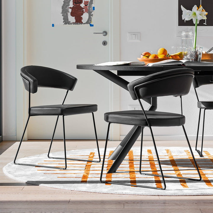 Giove Round Extendable Dining Table by Connubia in a styled interior